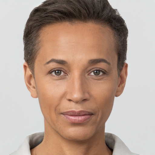 Joyful white adult female with short  brown hair and brown eyes