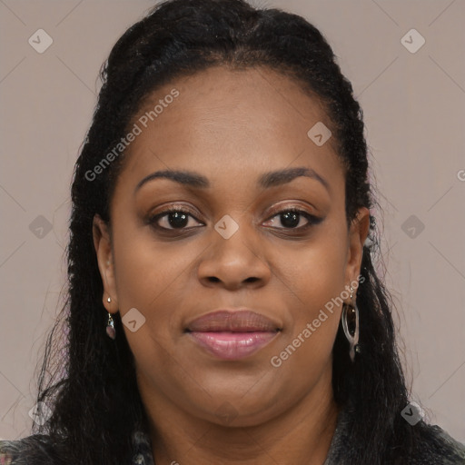 Joyful black young-adult female with long  black hair and brown eyes