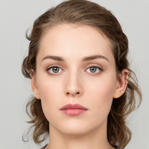 Neutral white young-adult female with medium  brown hair and grey eyes