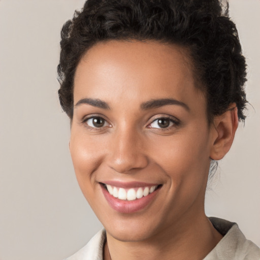 Joyful white young-adult female with short  brown hair and brown eyes