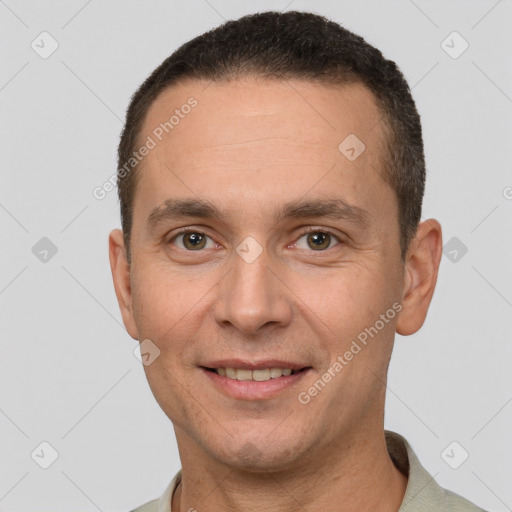 Joyful white adult male with short  brown hair and brown eyes