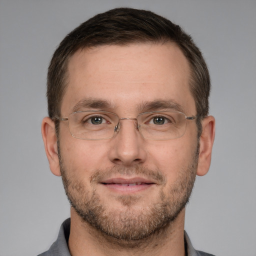 Joyful white adult male with short  brown hair and grey eyes