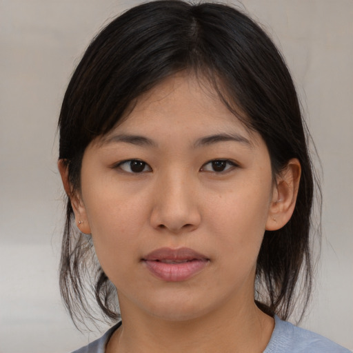 Neutral asian young-adult female with medium  brown hair and brown eyes