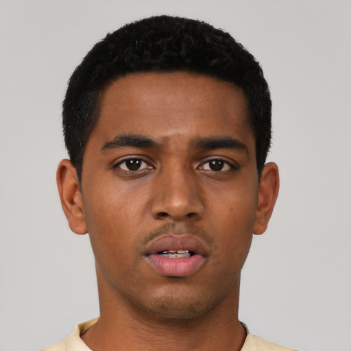 Neutral black young-adult male with short  black hair and brown eyes