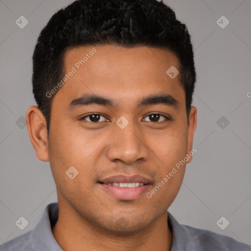 Joyful latino young-adult male with short  brown hair and brown eyes