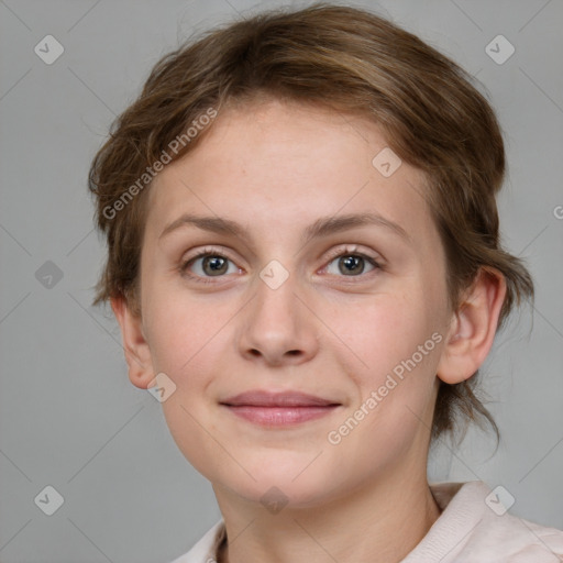 Joyful white young-adult female with medium  brown hair and blue eyes