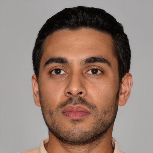 Neutral latino young-adult male with short  black hair and brown eyes