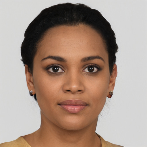 Joyful latino young-adult female with short  black hair and brown eyes