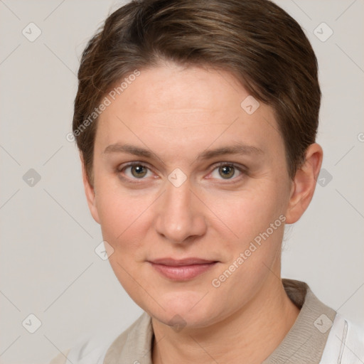 Joyful white young-adult female with short  brown hair and grey eyes