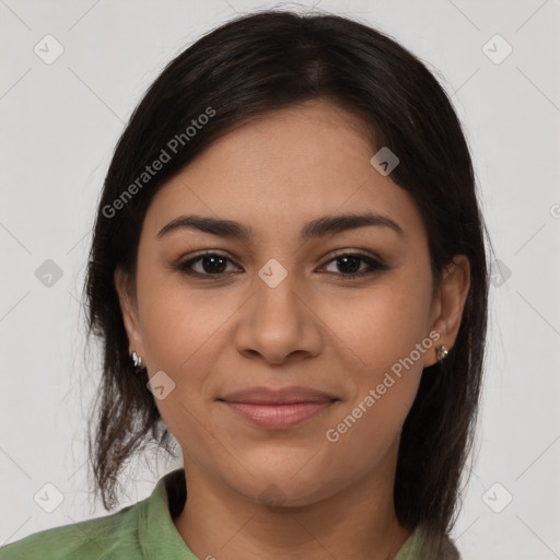 Joyful latino young-adult female with long  brown hair and brown eyes