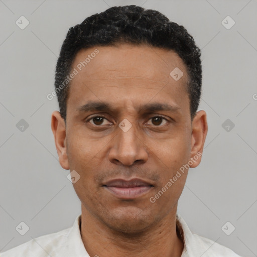 Neutral latino adult male with short  black hair and brown eyes