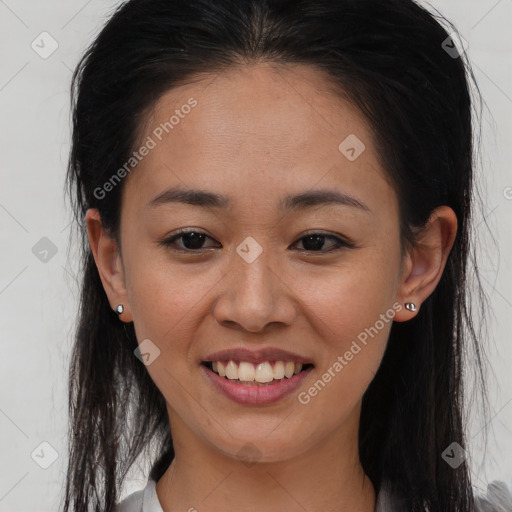 Joyful black young-adult female with long  brown hair and brown eyes