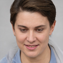 Joyful white adult female with short  brown hair and brown eyes