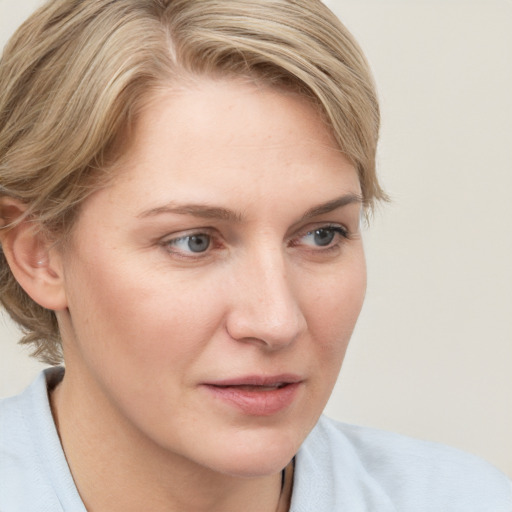 Neutral white young-adult female with medium  brown hair and blue eyes