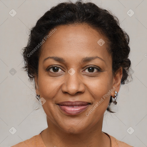 Joyful black adult female with medium  brown hair and brown eyes