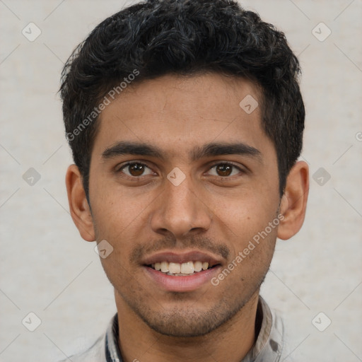 Joyful white young-adult male with short  black hair and brown eyes