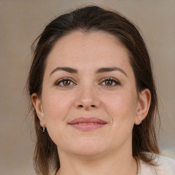 Joyful white young-adult female with medium  brown hair and brown eyes