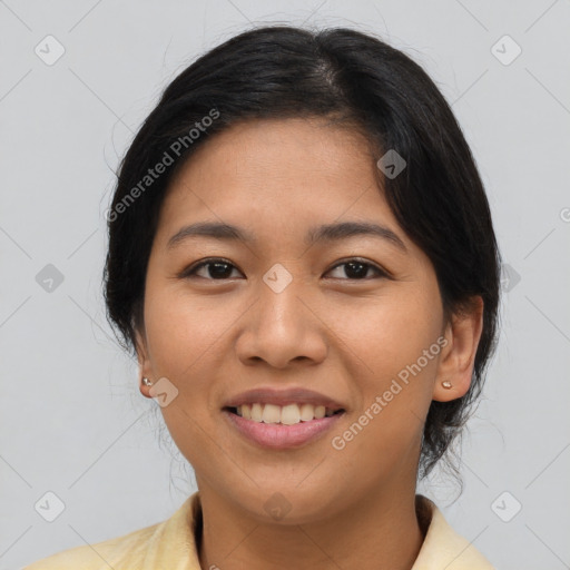 Joyful asian young-adult female with medium  brown hair and brown eyes