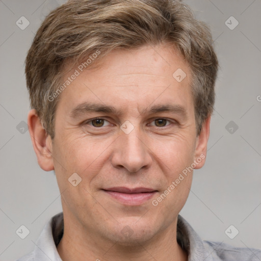 Joyful white adult male with short  brown hair and grey eyes