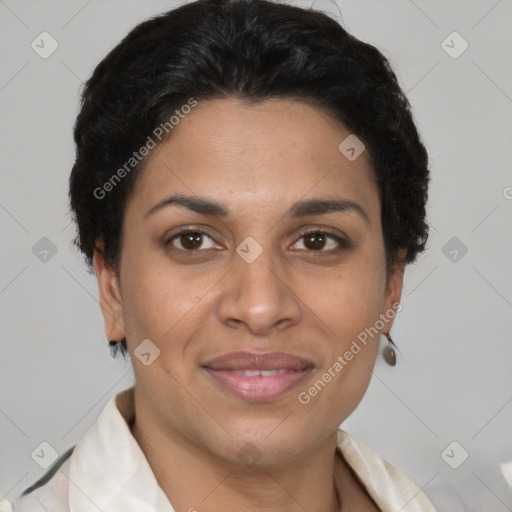 Joyful latino adult female with short  brown hair and brown eyes