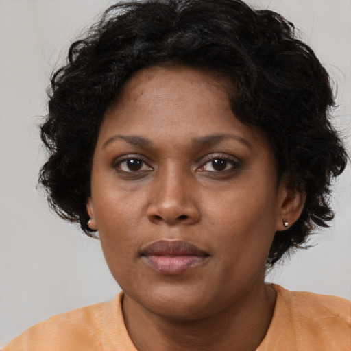 Neutral black young-adult female with short  black hair and brown eyes