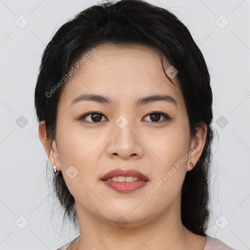 Joyful asian young-adult female with medium  black hair and brown eyes