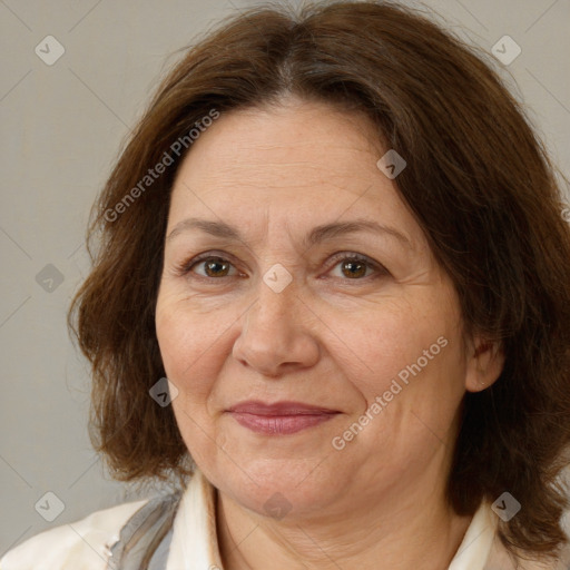 Joyful white adult female with medium  brown hair and brown eyes