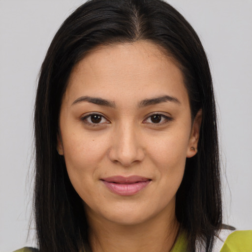 Joyful asian young-adult female with long  brown hair and brown eyes