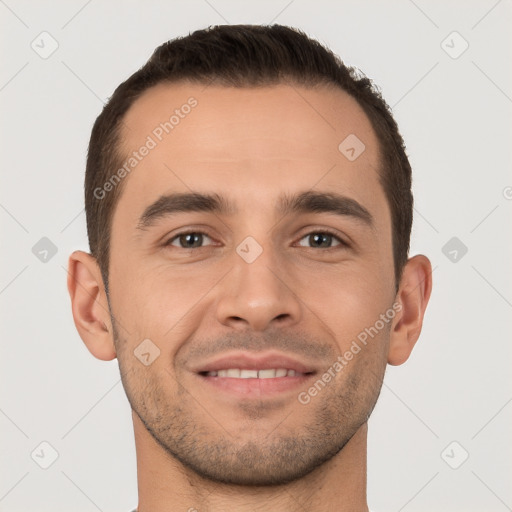 Joyful white young-adult male with short  brown hair and brown eyes