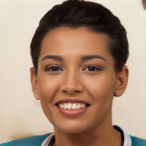 Joyful latino young-adult female with short  brown hair and brown eyes