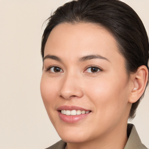 Joyful white young-adult female with medium  brown hair and brown eyes