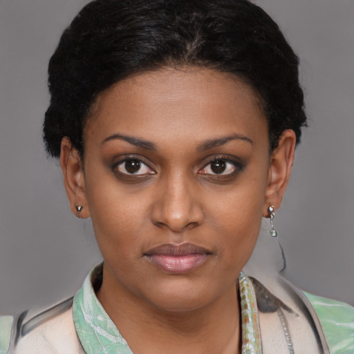 Joyful latino young-adult female with short  black hair and brown eyes