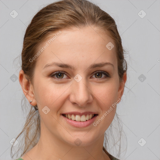 Joyful white young-adult female with medium  brown hair and grey eyes