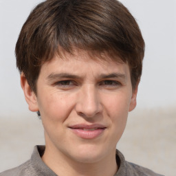 Joyful white adult male with short  brown hair and grey eyes