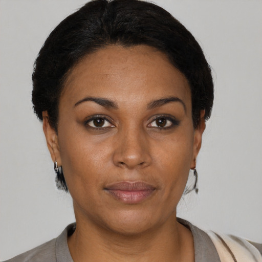 Neutral black young-adult female with short  black hair and brown eyes