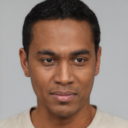 Neutral black young-adult male with short  black hair and brown eyes