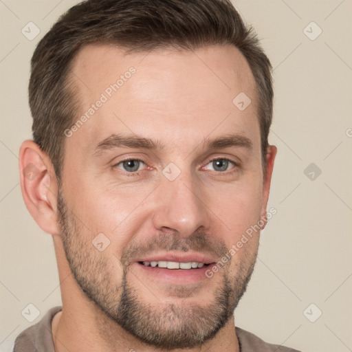 Joyful white adult male with short  brown hair and grey eyes