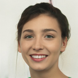 Joyful white young-adult female with short  brown hair and green eyes