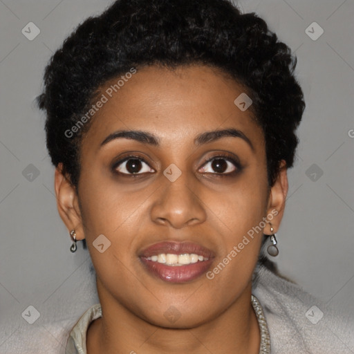 Joyful black young-adult female with short  brown hair and brown eyes