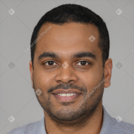 Joyful black young-adult male with short  black hair and brown eyes