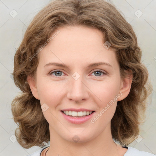 Joyful white young-adult female with medium  brown hair and green eyes