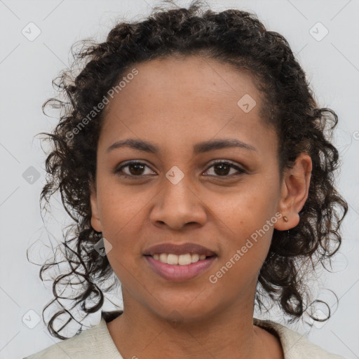 Joyful black young-adult female with medium  brown hair and brown eyes