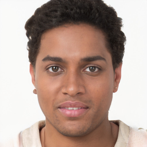 Joyful black young-adult male with short  brown hair and brown eyes