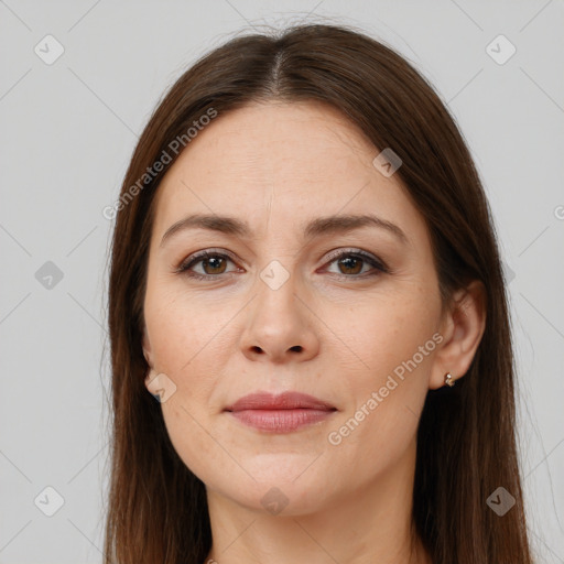 Joyful white young-adult female with long  brown hair and brown eyes