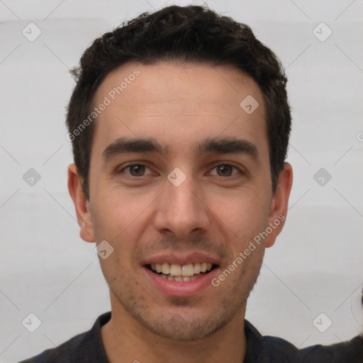 Joyful white young-adult male with short  black hair and brown eyes