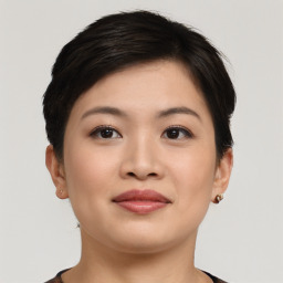 Joyful asian young-adult female with short  brown hair and brown eyes