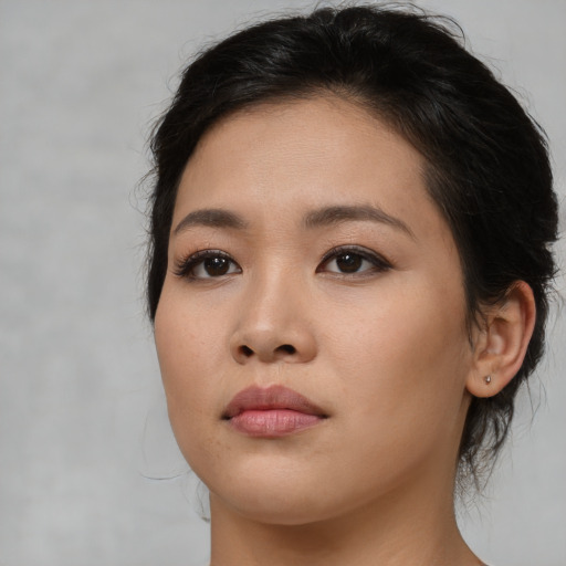 Neutral asian young-adult female with medium  brown hair and brown eyes