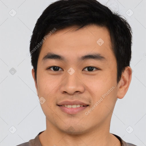 Joyful asian young-adult male with short  black hair and brown eyes