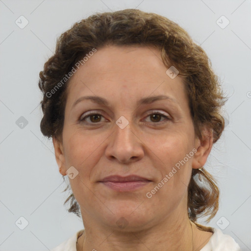 Joyful white adult female with short  brown hair and brown eyes