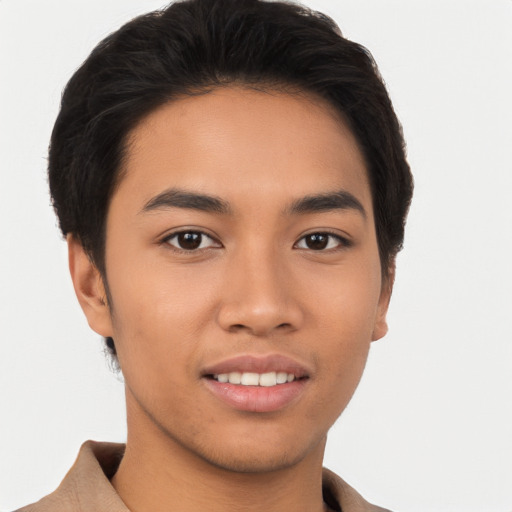 Joyful asian young-adult male with short  brown hair and brown eyes